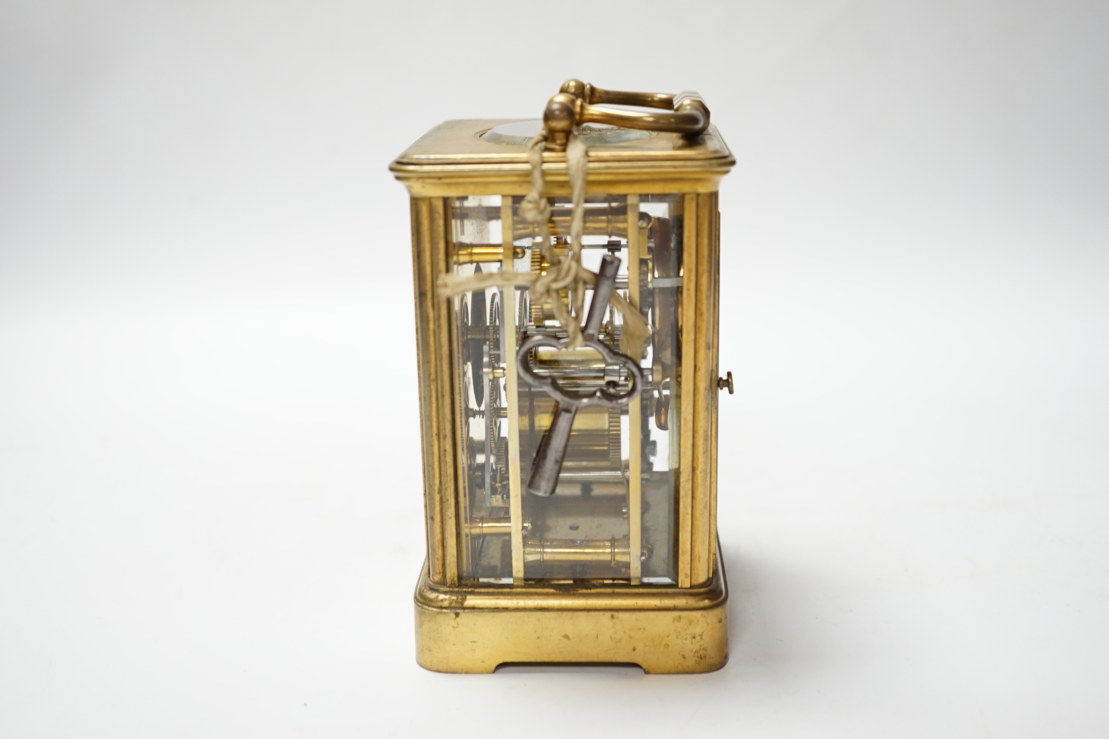 A brass carriage clock with subsidiary dial, 16cm high